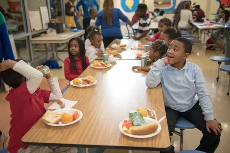 Happy kids at a lunch table