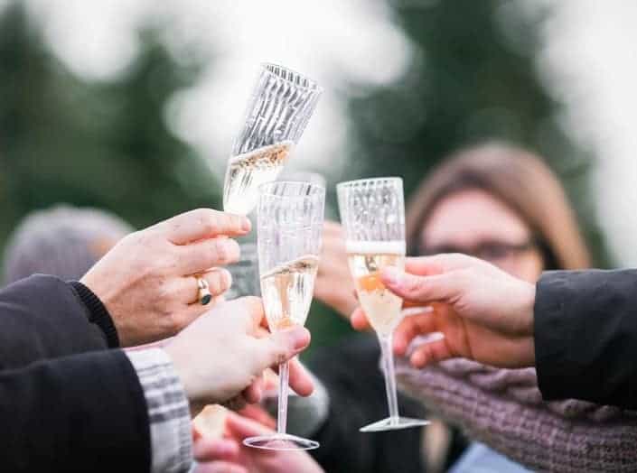 Happy people cheersing with champagne