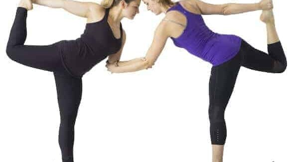 Two women doing yoga