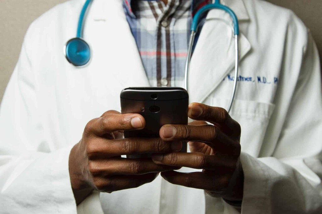 A doctor holding a mobile phone