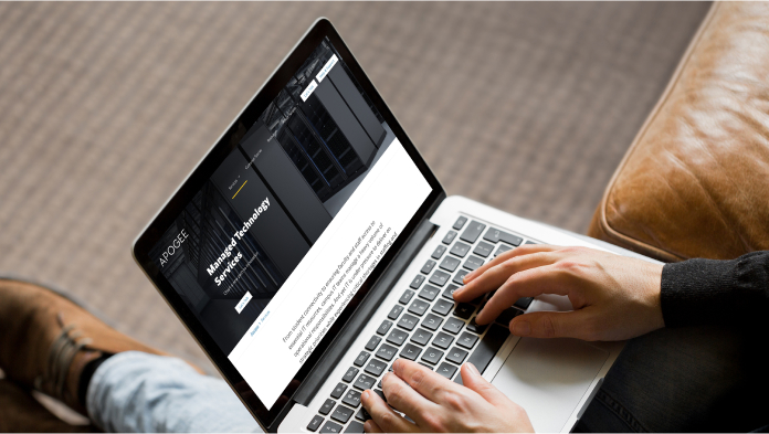 Apogee Managed Technology Services on laptop browsing