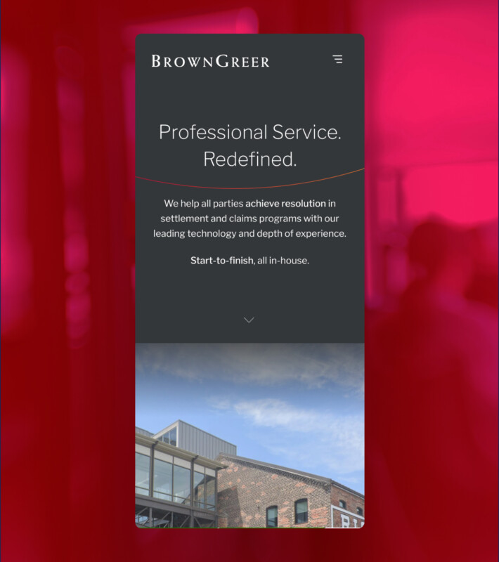 A mobile website interface for BrownGreer features a dark background with white text. The main heading reads "Professional Service. Redefined." Below, a brief description outlines their services in settlement and claims programs, emphasizing their technology and experience. The section concludes with "Start-to-finish, all in-house." An image of a modern building with a glass facade and brick exterior is visible at the bottom, showcasing a blend of contemporary and traditional architecture. The background is a soft red gradient.